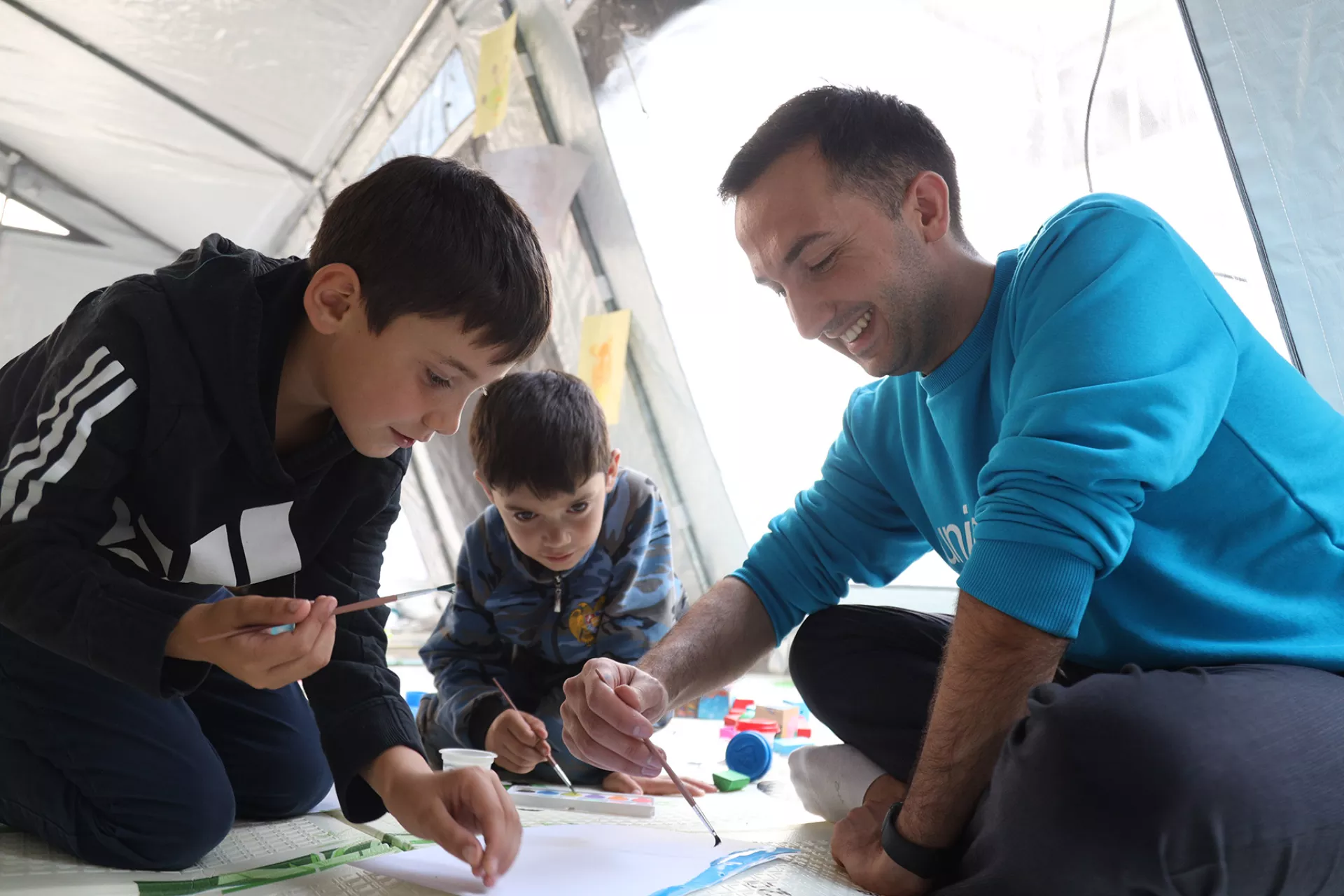 UNICEF’s Social Protection Officer playing with children who have fled to Armenia due to the escalation of conflict in the region