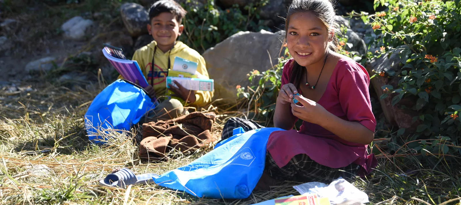 Children in Nepal with educational supplies