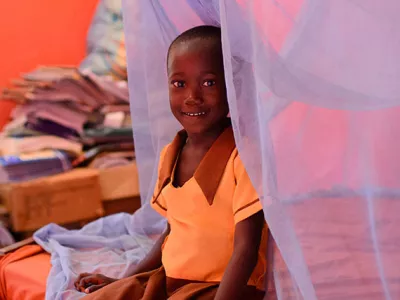 Margaret Agyapong, (6) in the bedroom where she and her siblings sleep under a long-lasting insecticide-treated bed net (LLI) in the village of Ankaase in the Western Region of Ghana, in October 2012.