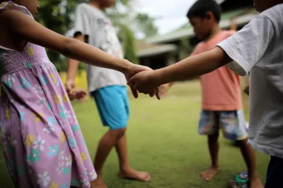 Children holding hands in the Philippines