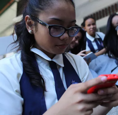 a girl in the philippines on her phone