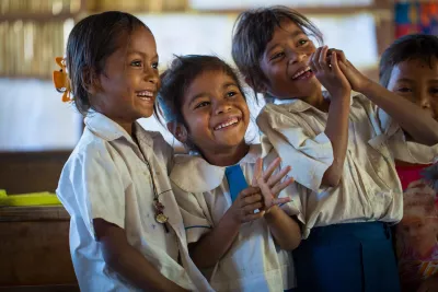 Silvina Barreto (Middle), is attending preschool at Si-Rui Suco Laubonu, Ermera Municipality, Timor-Leste. 