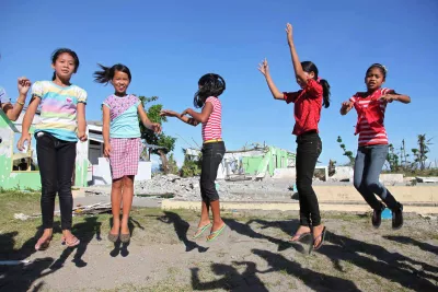 girls jumping together in the Philippines