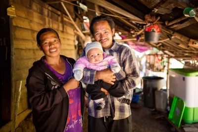 a mother and father with their baby in Chiang Mai, Thailand