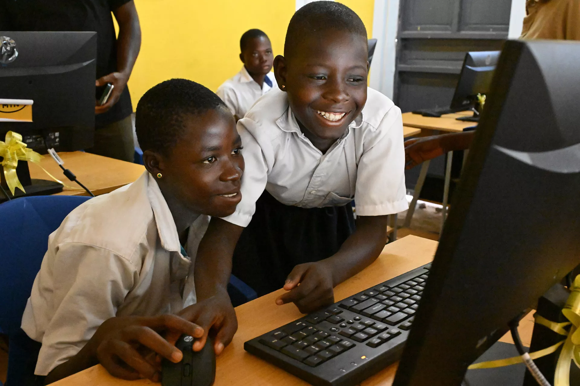 School children work on a computer
