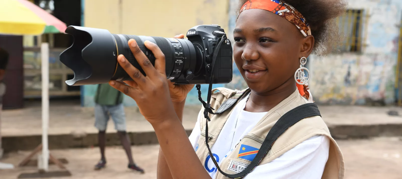 A young reporter with her camera in Mbandaka, the Equatorial Provence of the Democratic Republic of Congo