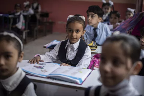 On 3 March 2022 in Iraq, 6-year-old Azel studies in class at Al Tasneem School in Basra.