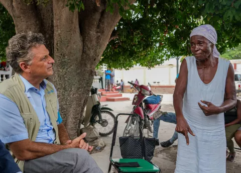 Haiti. Bruno Maes, UNICEF Representative in Haiti, talks to a woman during a visit to Artibonite department.