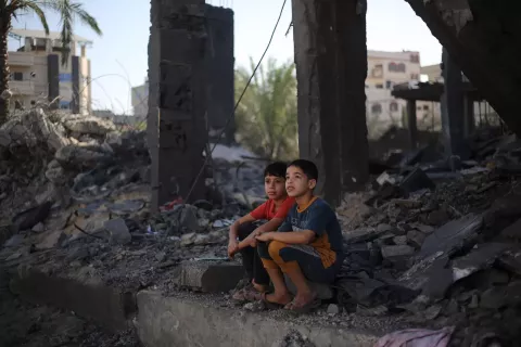 The Gaza Strip. Two children sitting in the rubble of what is left of their house in Rafah city.