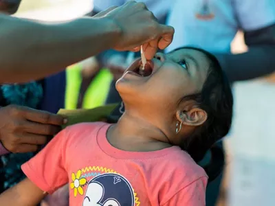 A girl is vaccinate against Cholera in Oudomxay camp, Attapeu, Lao PDR, July 2018